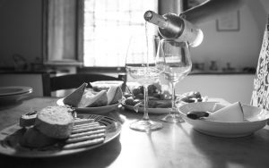 Wine being poured on dinner table